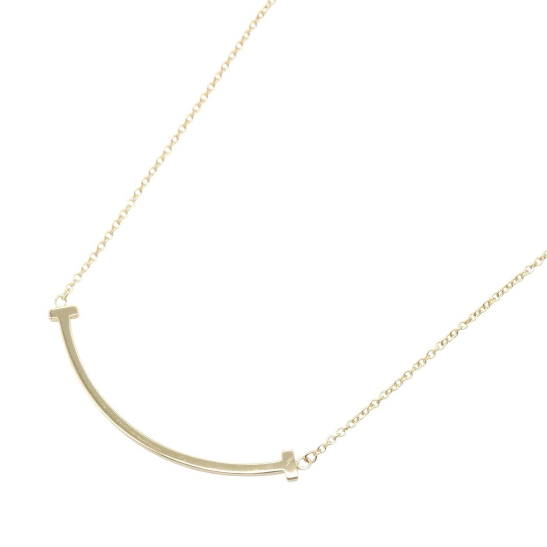 Tiffany T Smile Small Necklace: T Smile Small necklace in K18 yellow gold.