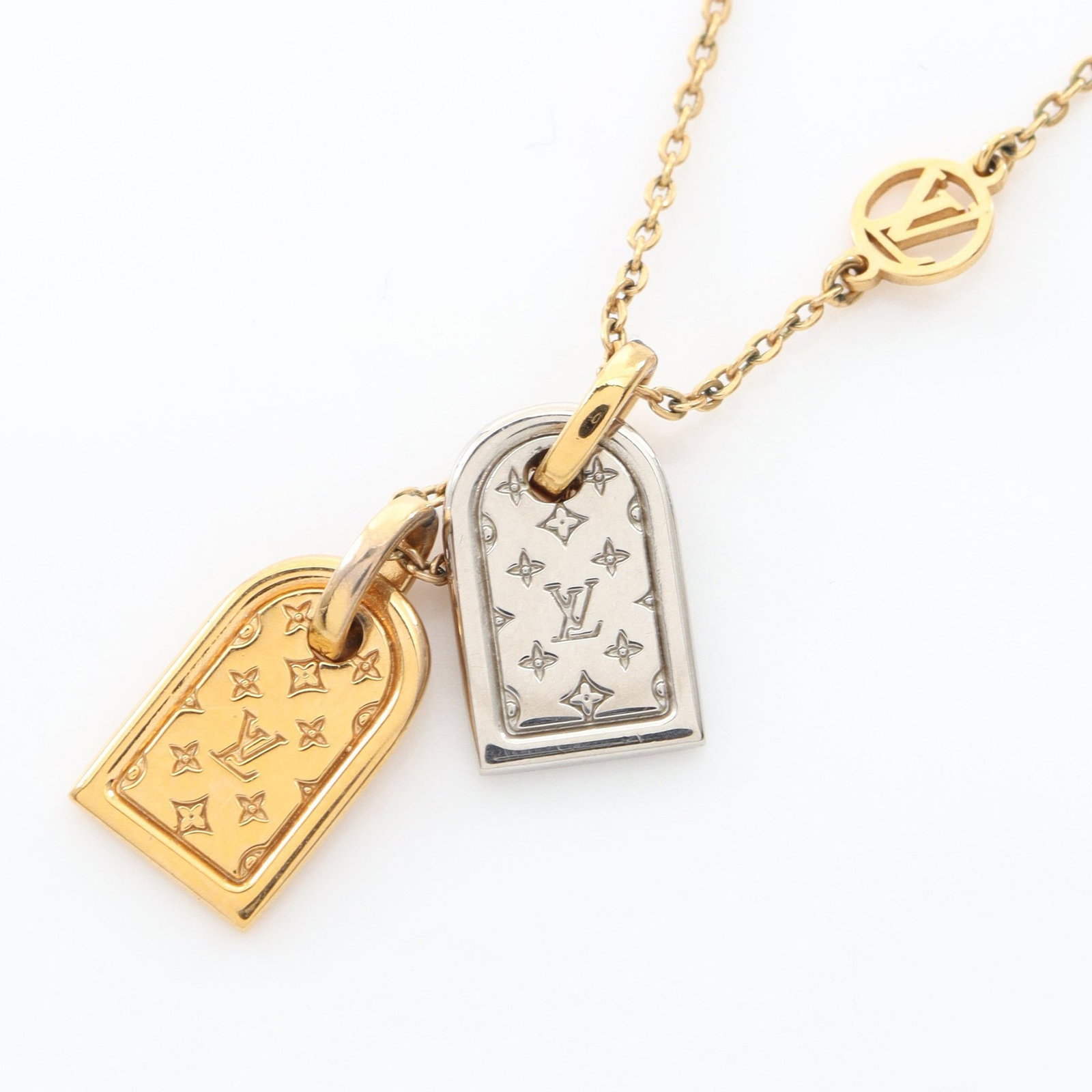 Louis Vuitton Nanogram Necklace: Nanogram necklace in gold and silver tone.