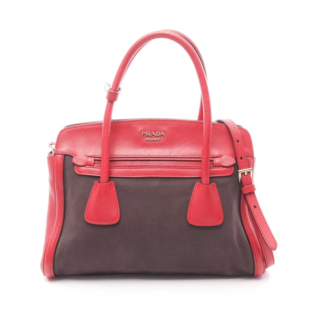 Prada Canapa Saffiano 2 Way Black: Canapa and saffiano 2 way handbag in black and red. Size 34 x 24 x 15 cm.