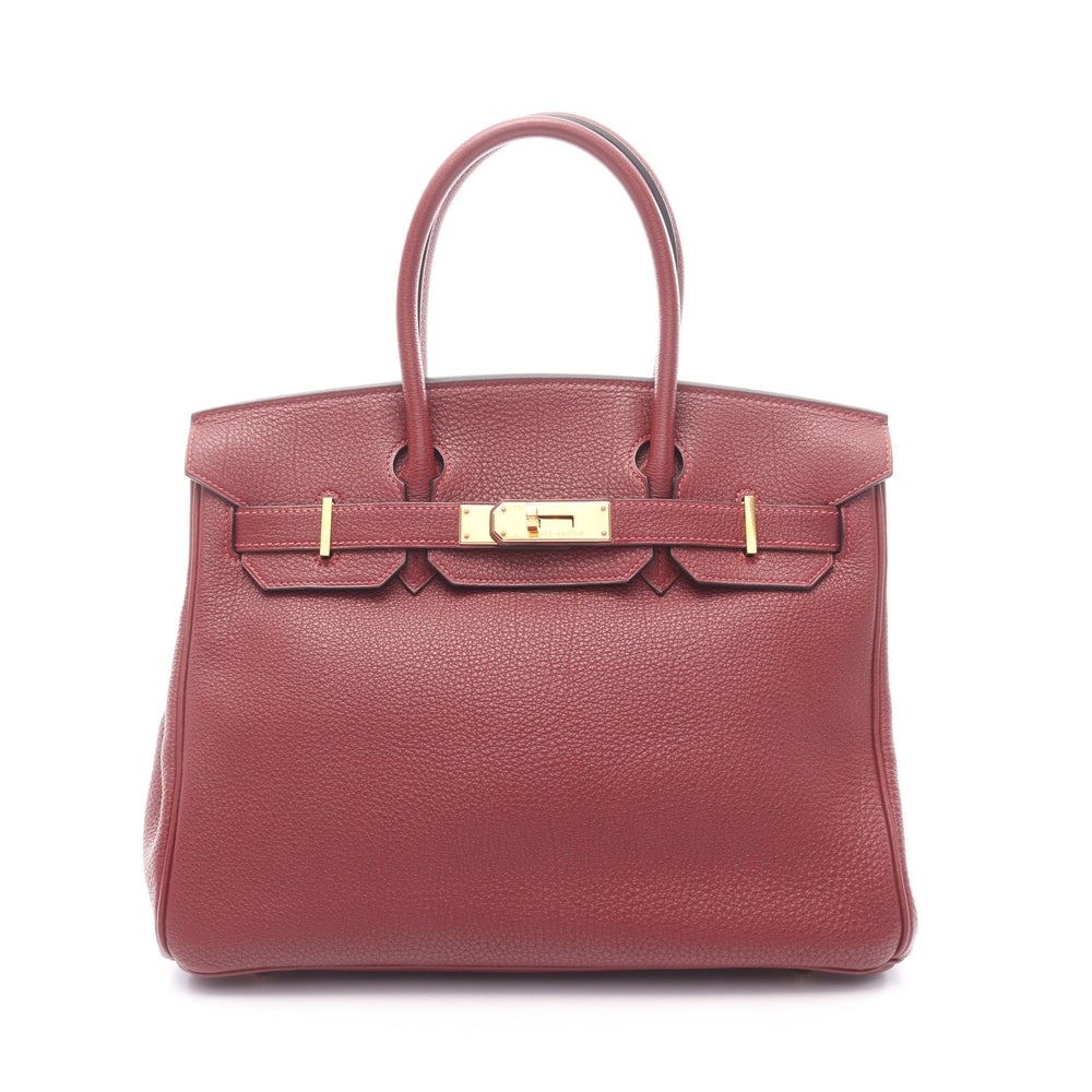 Hermes Birkin 30 Rouge Ash: Bordeaux Togo leather handbag with gold-tone hardware.