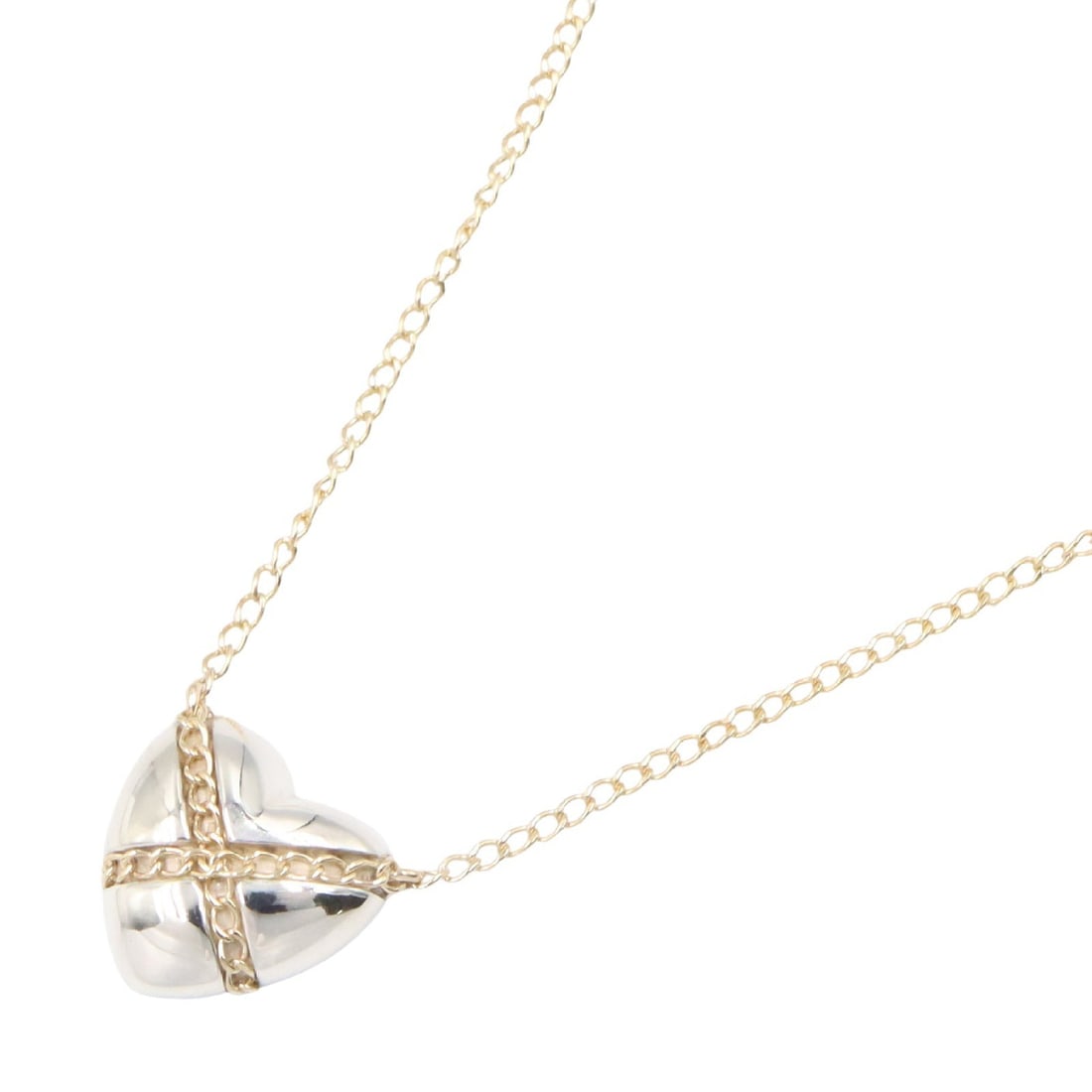 Tiffany Cross Heart Necklace: Cross Heart necklace in SV925 silver and K14 yellow gold.