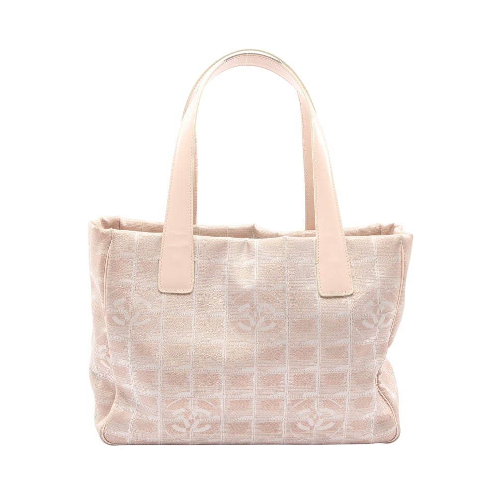 Chanel New Travel Line PM Pink Beige: New Travel Line PM tote in pink beige nylon canvas and leather with gold-tone hardware. Includes guarantee card and serial seal. Size 29 x 21 x 12 cm.