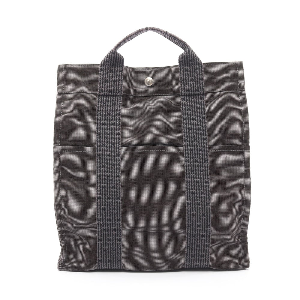 Hermes Herline Ado MM Backpack: Herline Ado MM backpack in dark gray nylon canvas with silver-tone hardware. Size 32 x 33 x 12 cm. Strap 49 to 87 cm.