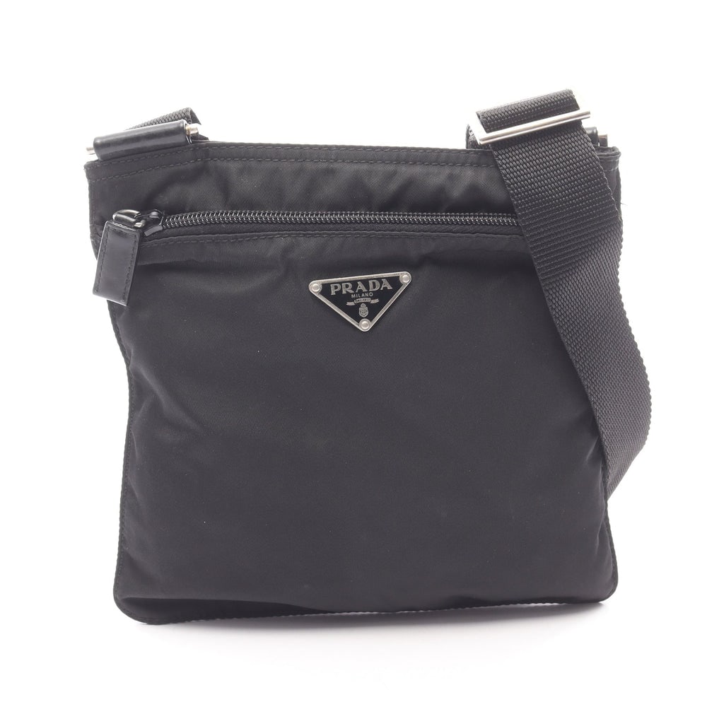 Prada Nylon Leather Shoulder Black: Shoulder bag in black nylon and leather. Size 21 x 20.5 x 1 cm. Strap 70 to 128 cm.