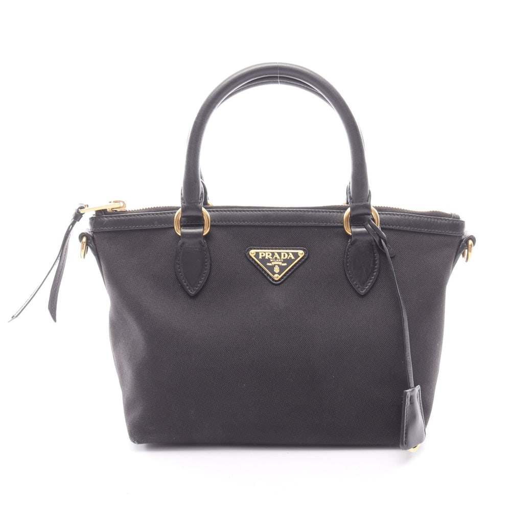 Prada Canvas Handbag Black: Handbag in black canvas and leather. Includes crochet with key ring. Size 22 x 18.5 x 13 cm.