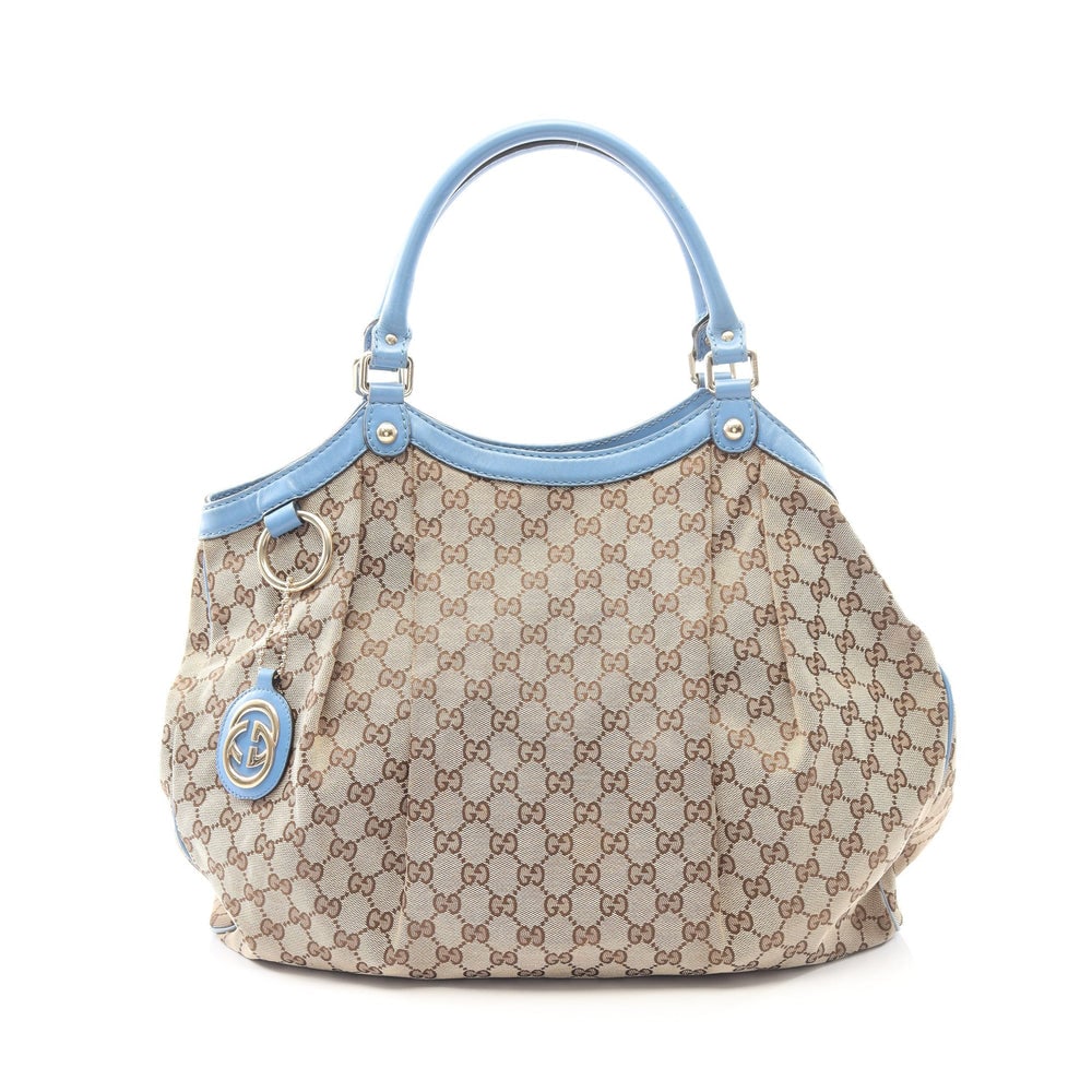 Gucci Sukey GG Canvas Beige Blue: Sukey GG canvas shoulder bag in beige and light blue. Size 41 x 37 x 13 cm.