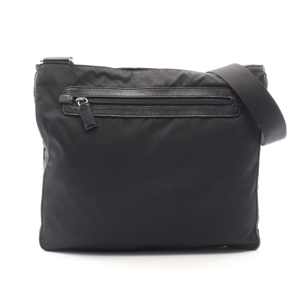 Prada Triangle Logo Shoulder Black: Triangle logo shoulder bag VA0348 in black nylon and saffiano leather. Size 34 x 30 x 3 cm. Strap 73 to 133 cm.