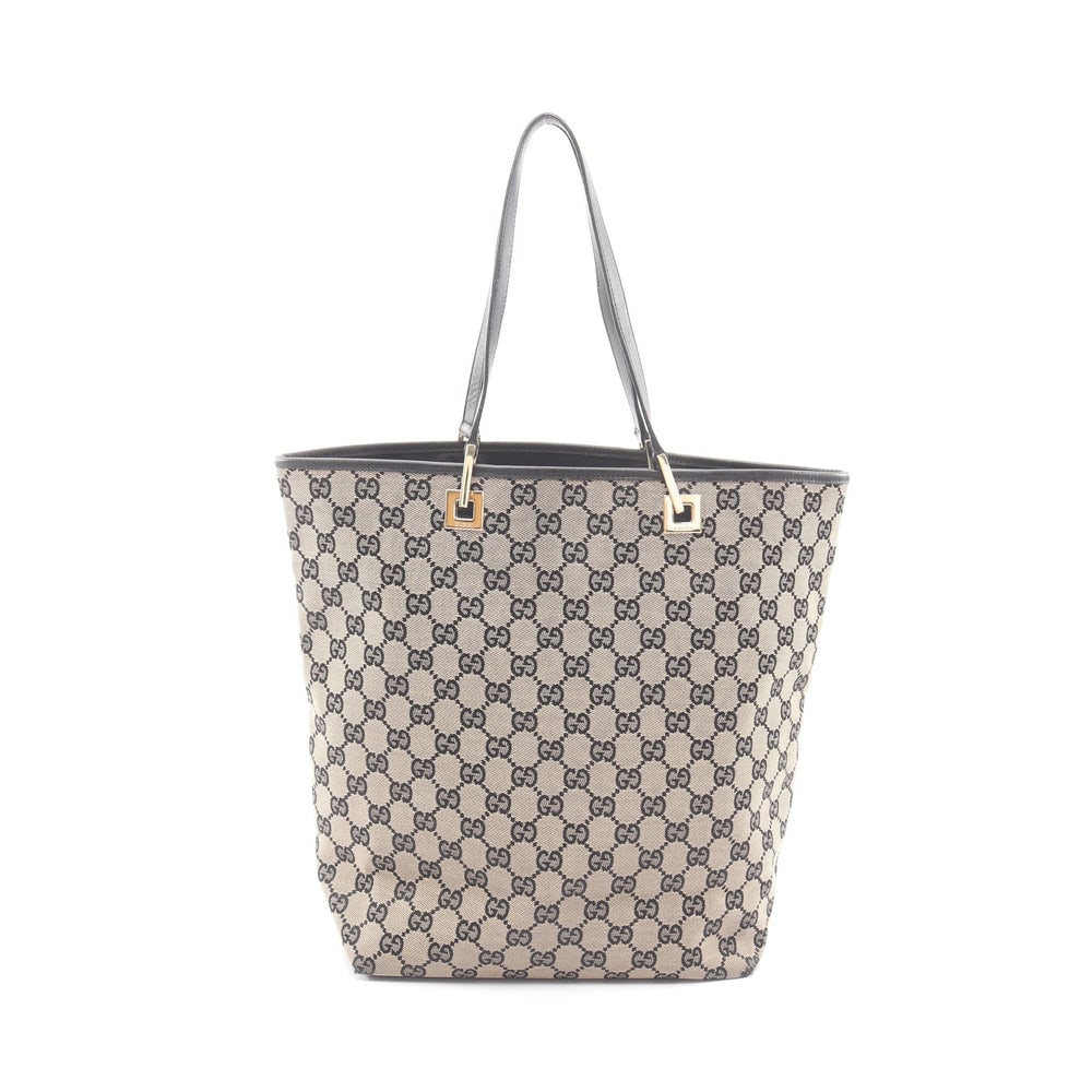 Gucci GG Canvas Tote Beige Black: GG canvas tote in beige and black with leather trim. Size 25 x 31 x 11.5 cm. Handle 45 cm.