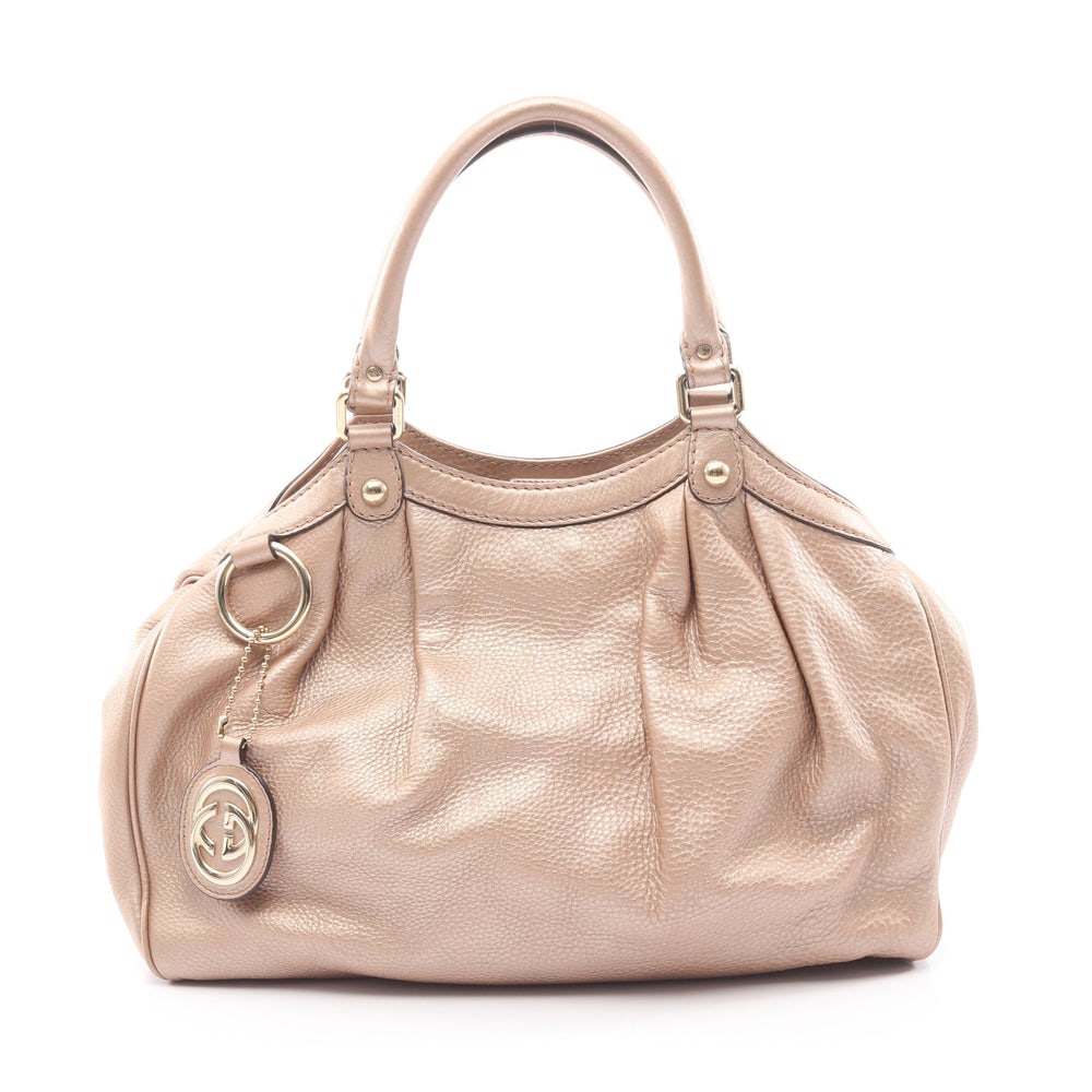 Gucci Sukey Handbag Light Beige: Sukey handbag in light beige leather. Includes charm. Size 35 x 25 x 11.5 cm.