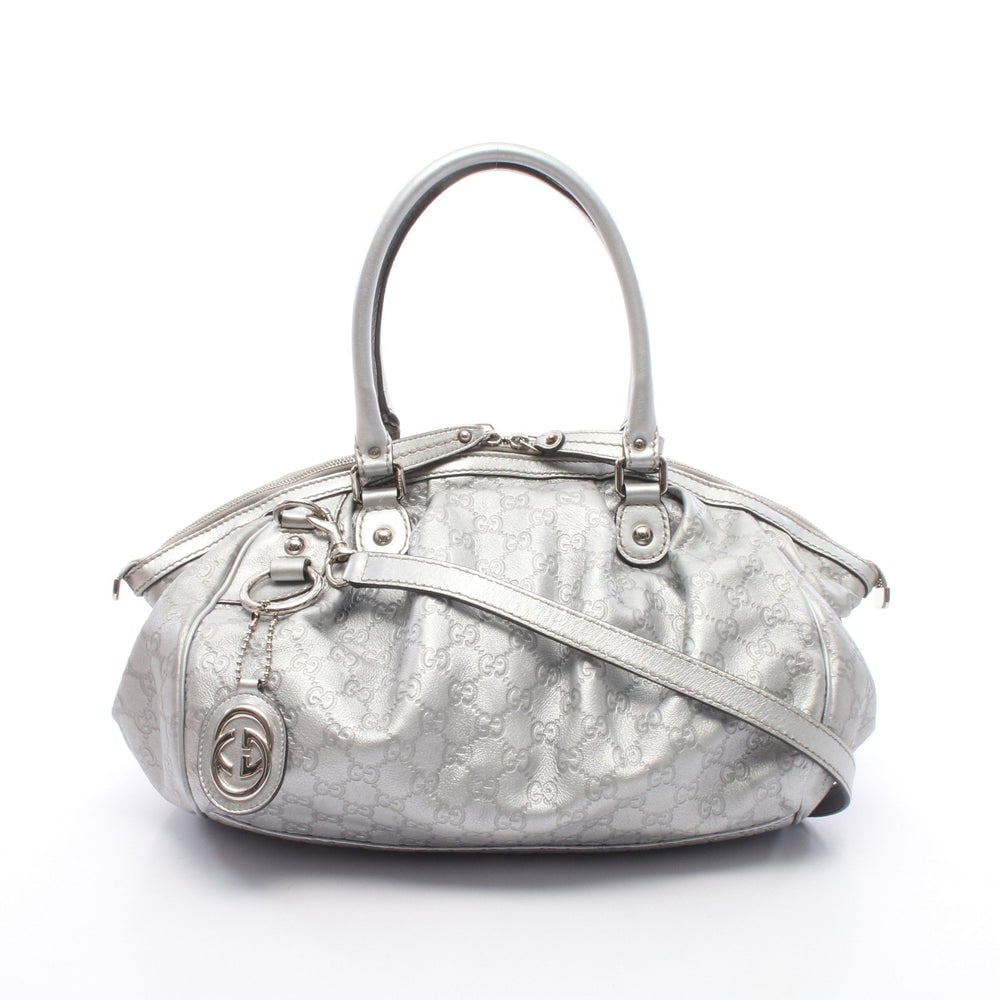 Gucci Sukey Guccissima 2 Way Silver: Sukey Guccissima 2 way handbag in silver leather. Includes shoulder strap and charm. Size 34 x 27 x 16 cm.