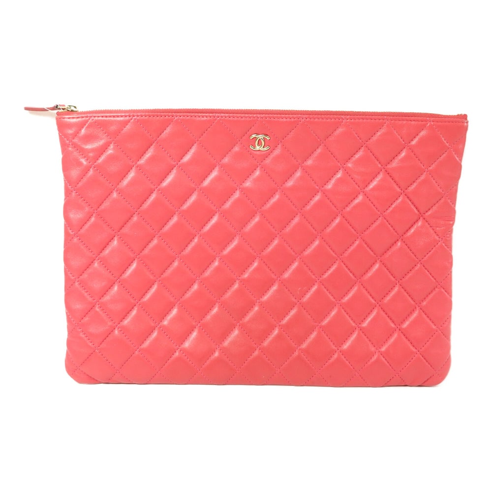 Chanel Lambskin Clutch Pink: Clutch pouch bag in pink lambskin with gold-tone hardware. Includes hologram sticker. Size 33.5 x 24 x 1 cm.
