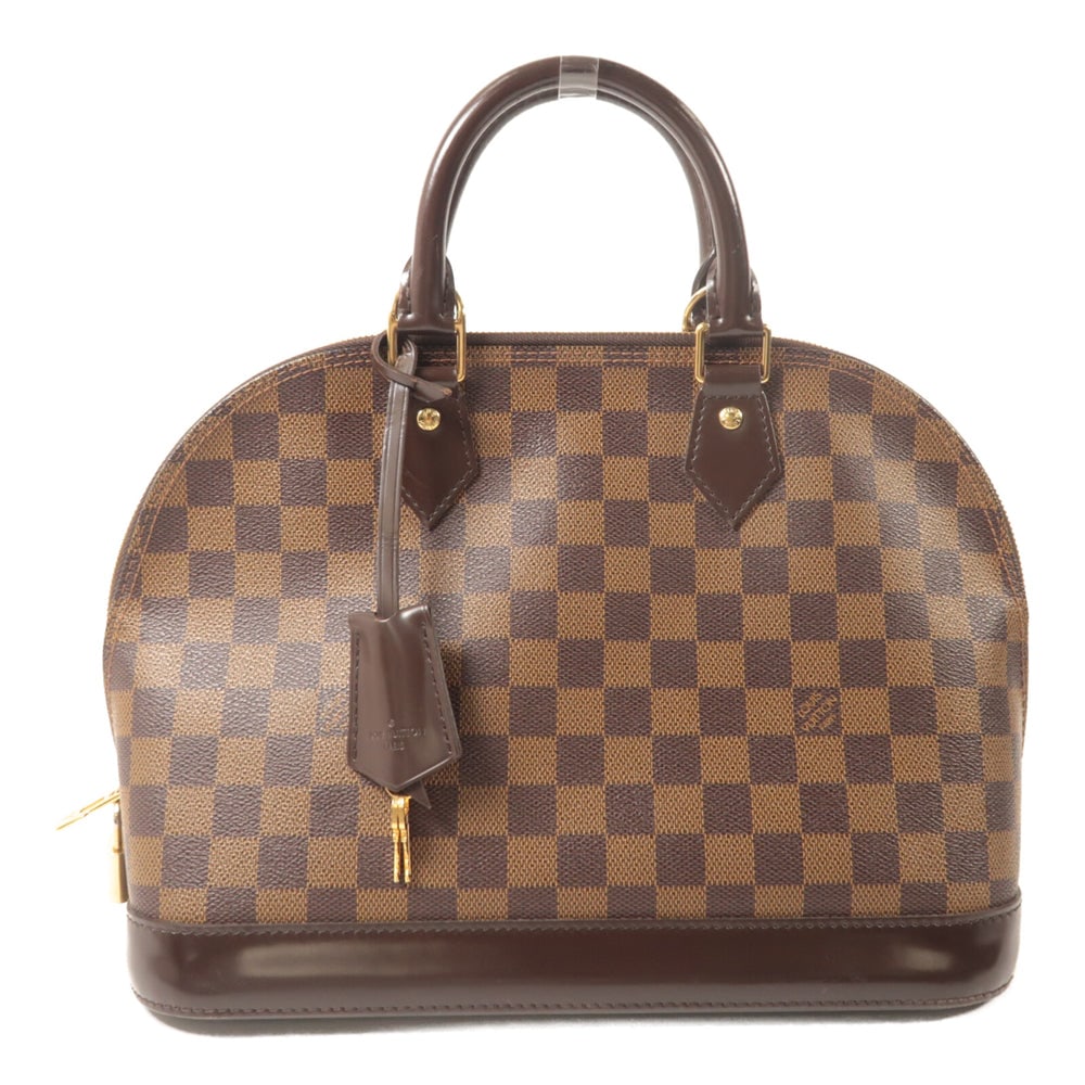 Louis Vuitton Alma PM Damier: Alma PM handbag in brown Damier Ebene canvas. Includes clochette, key, and padlock. Size 31 x 24 x 15 cm.