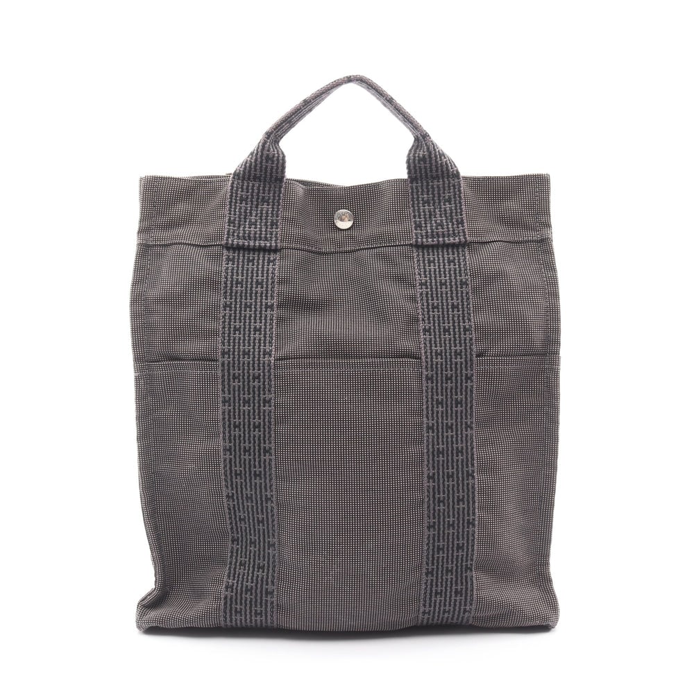 Hermes Herline Ado MM Backpack: Herline Ado MM backpack in dark gray nylon canvas with silver-tone hardware. Size 32 x 33 x 12 cm. Strap 49 to 87 cm.