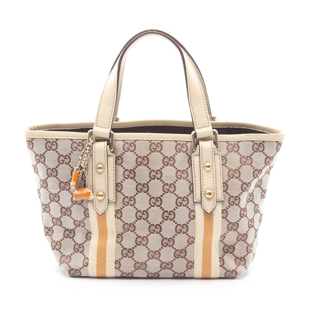 Gucci GG Canvas Tote Beige Ivory: GG canvas tote in beige ivory and yellow brown with leather trim. Size 21 x 18 x 11 cm. Handle 31 cm.
