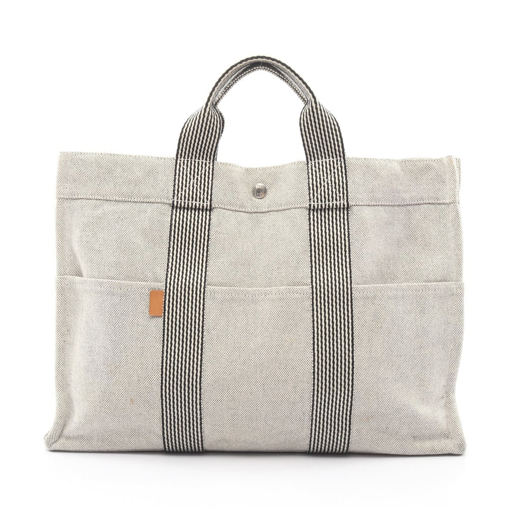 Hermes New Fool Toe MM Tote Gray: New Fool Toe MM tote in light gray and black canvas with silver-tone hardware. Size 42 x 30 x 10 cm. Handle 27 cm.