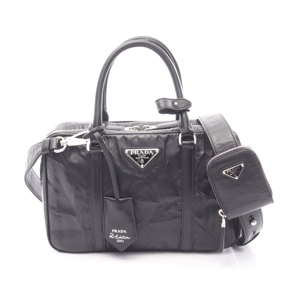 Prada Re-Edition 2001 2 Way Bag: Black leather 2 way handbag.