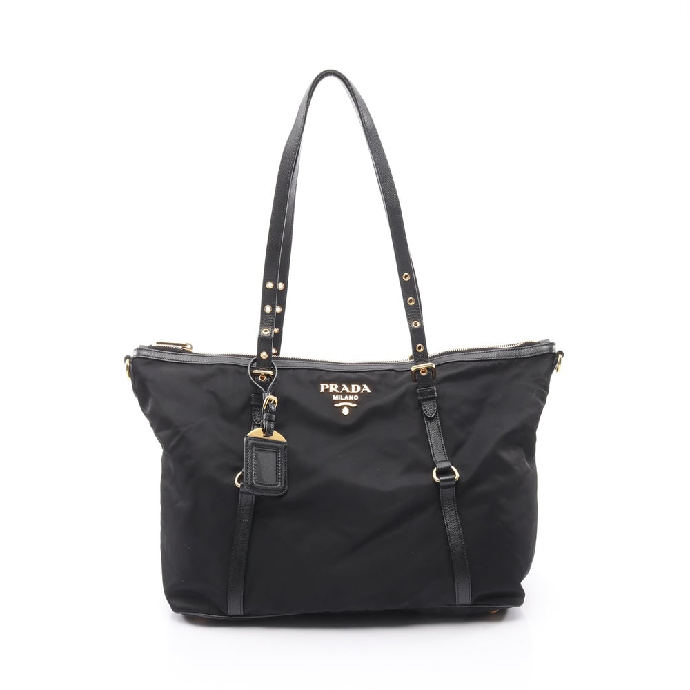 Prada Nylon Tote Black: Shoulder tote in black nylon and leather. Includes name tag. Size 36 x 28 x 14.5 cm. Handle 50 to 70 cm.