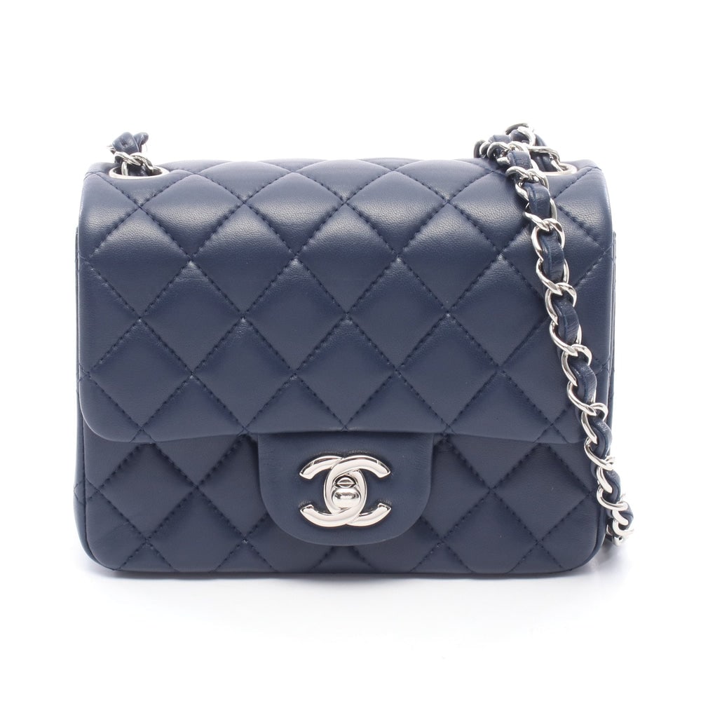Chanel Mini Matelasse Navy: Navy lambskin mini matelasse chain shoulder bag with silver-tone hardware.