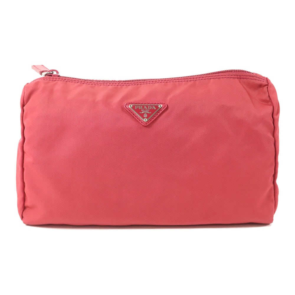 Prada Nylon Pouch Red: Nylon pouch in red with silver-tone hardware. Size 24 x 15 x 8 cm.