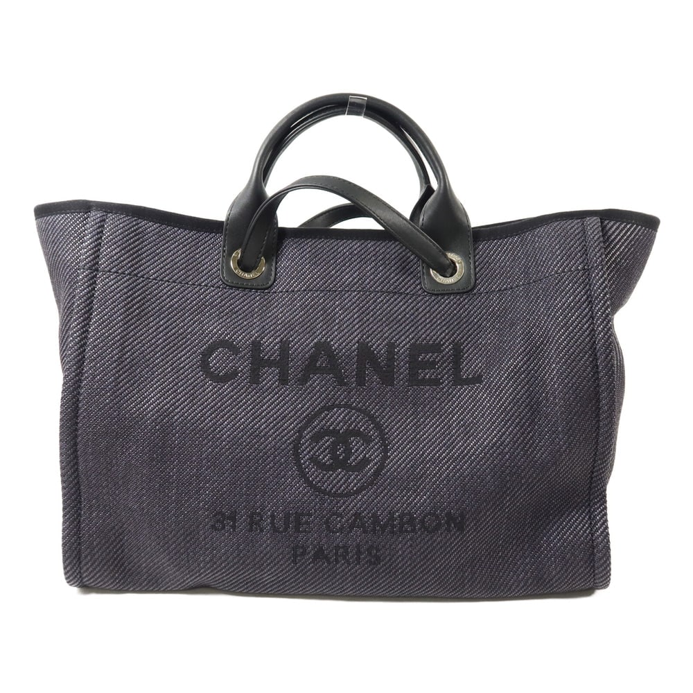 Chanel Deauville Tote Black: Black canvas and calfskin 2-way tote with silver-tone hardware.