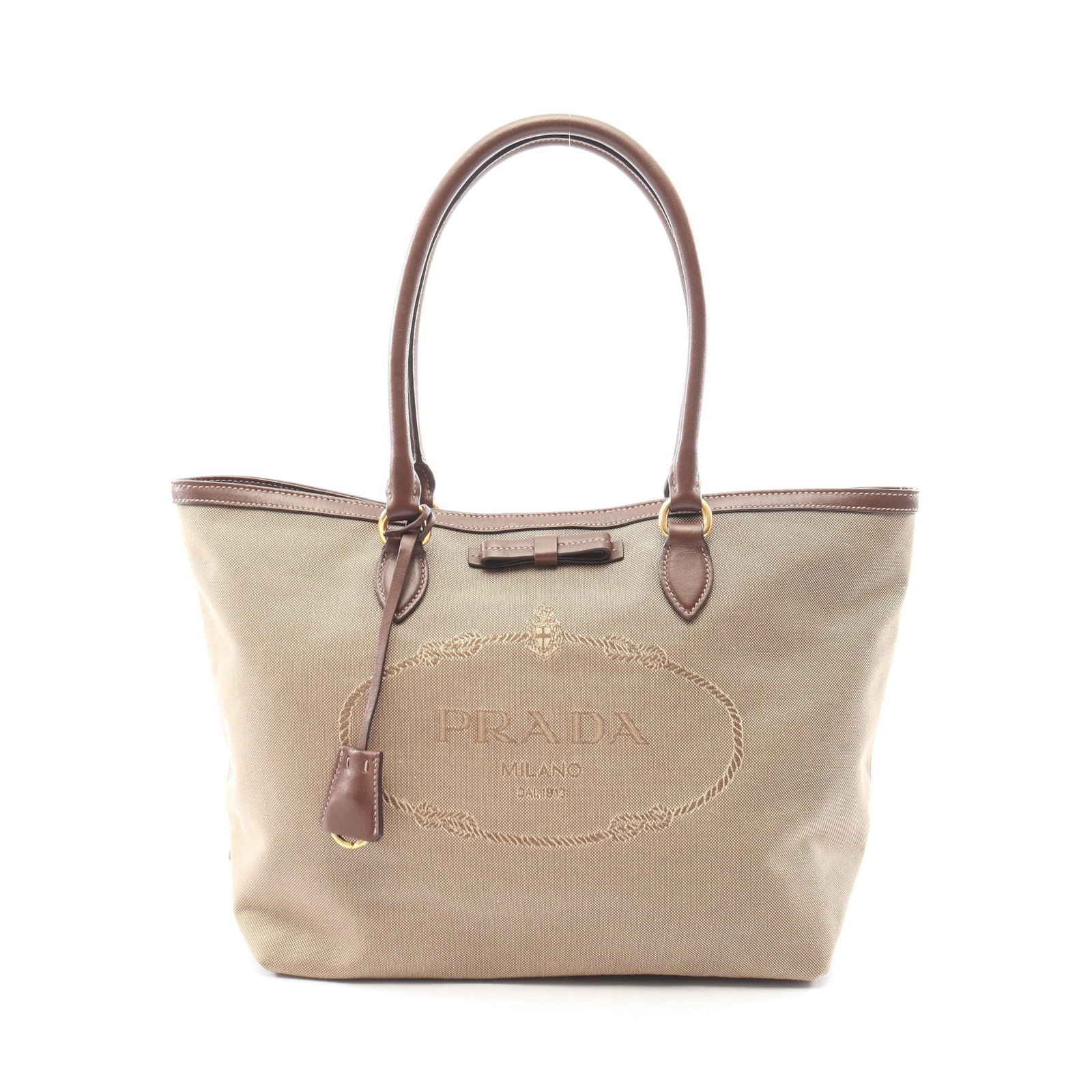 Prada Logo Jacquard Tote Beige: Logo Jacquard shoulder tote in beige and dark brown canvas and leather. Includes crochet with key ring and guarantee card. Size 30.5 x 27 x 15 cm.