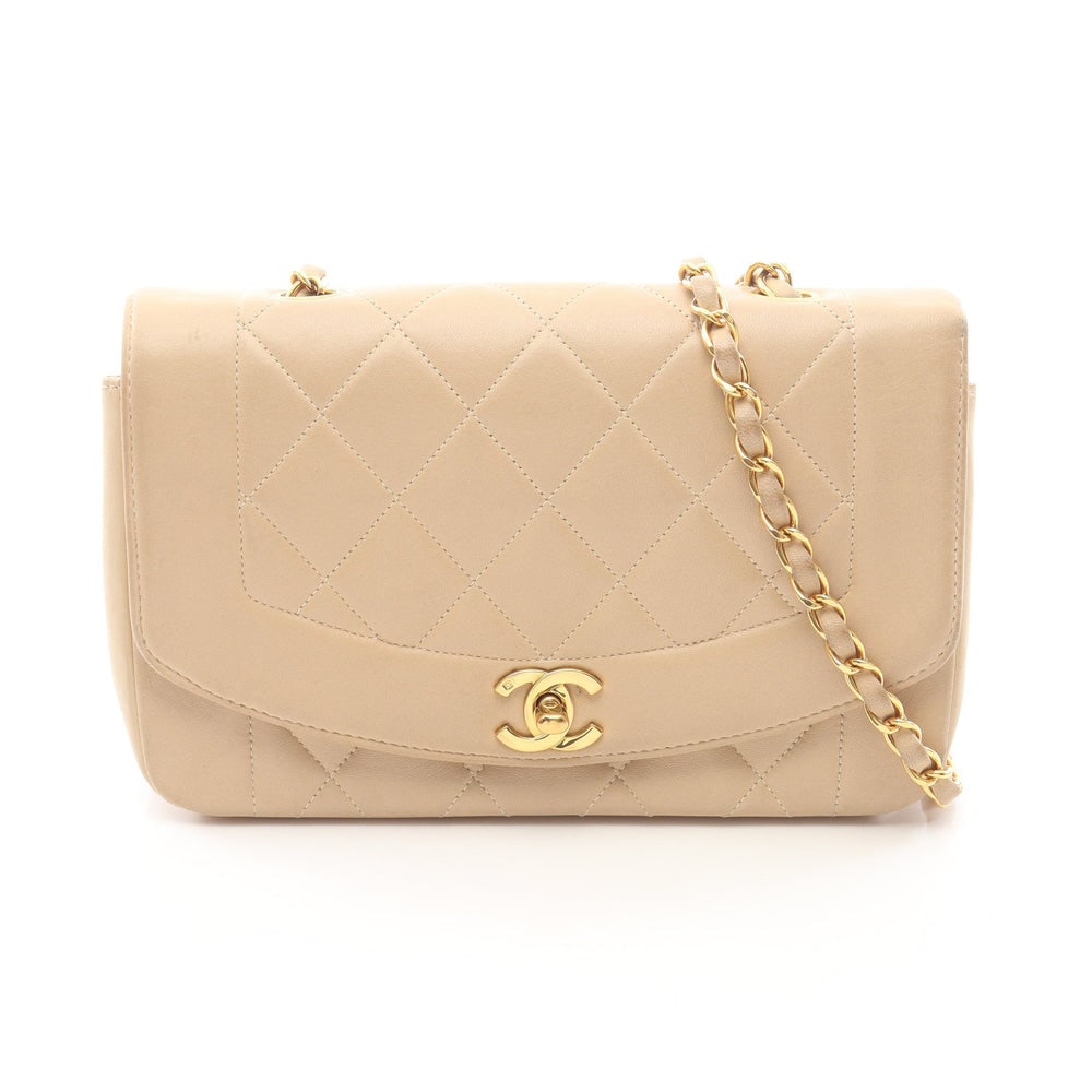 Chanel Diana Flap Beige: Beige lambskin Diana flap chain shoulder bag with gold-tone hardware.