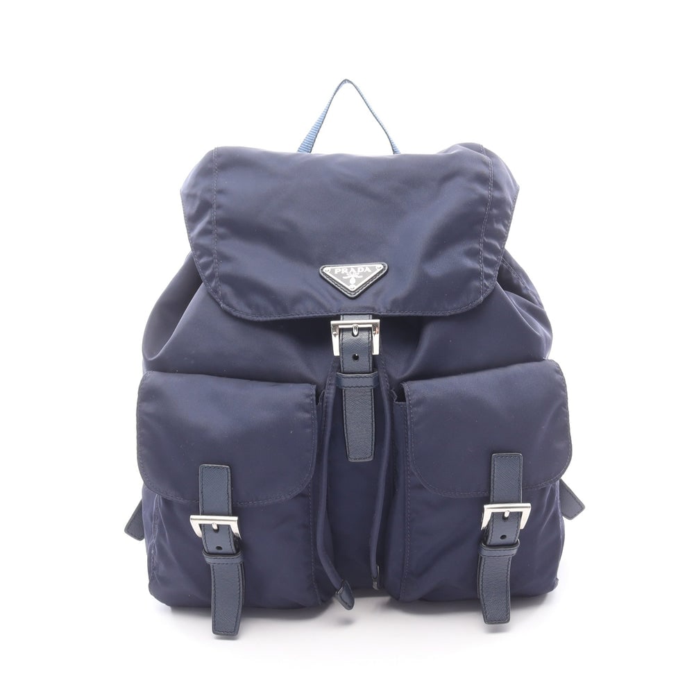 Prada Nylon Backpack Navy: Backpack in navy nylon and saffiano leather. Size 30 x 31 x 15 cm.