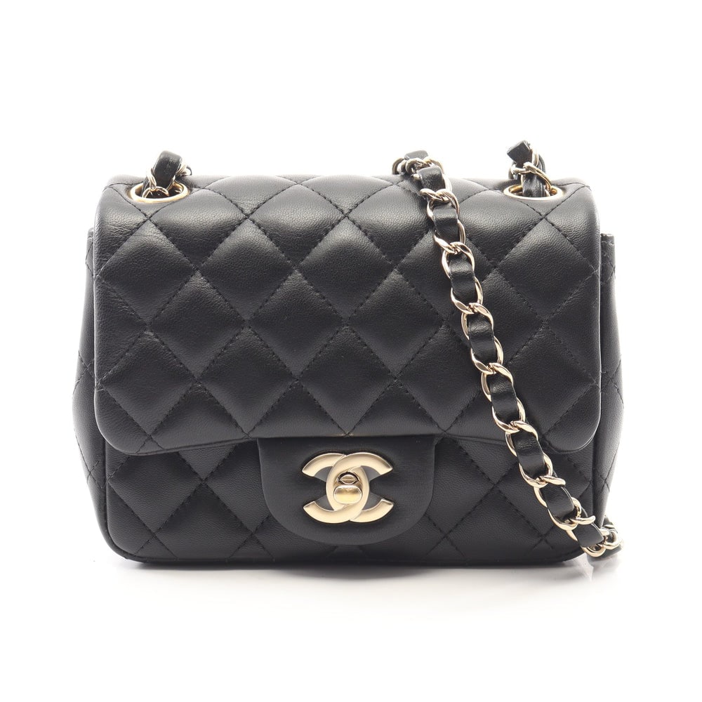 Chanel Mini Matelasse Black: Black lambskin mini matelasse chain shoulder bag with gold-tone hardware.