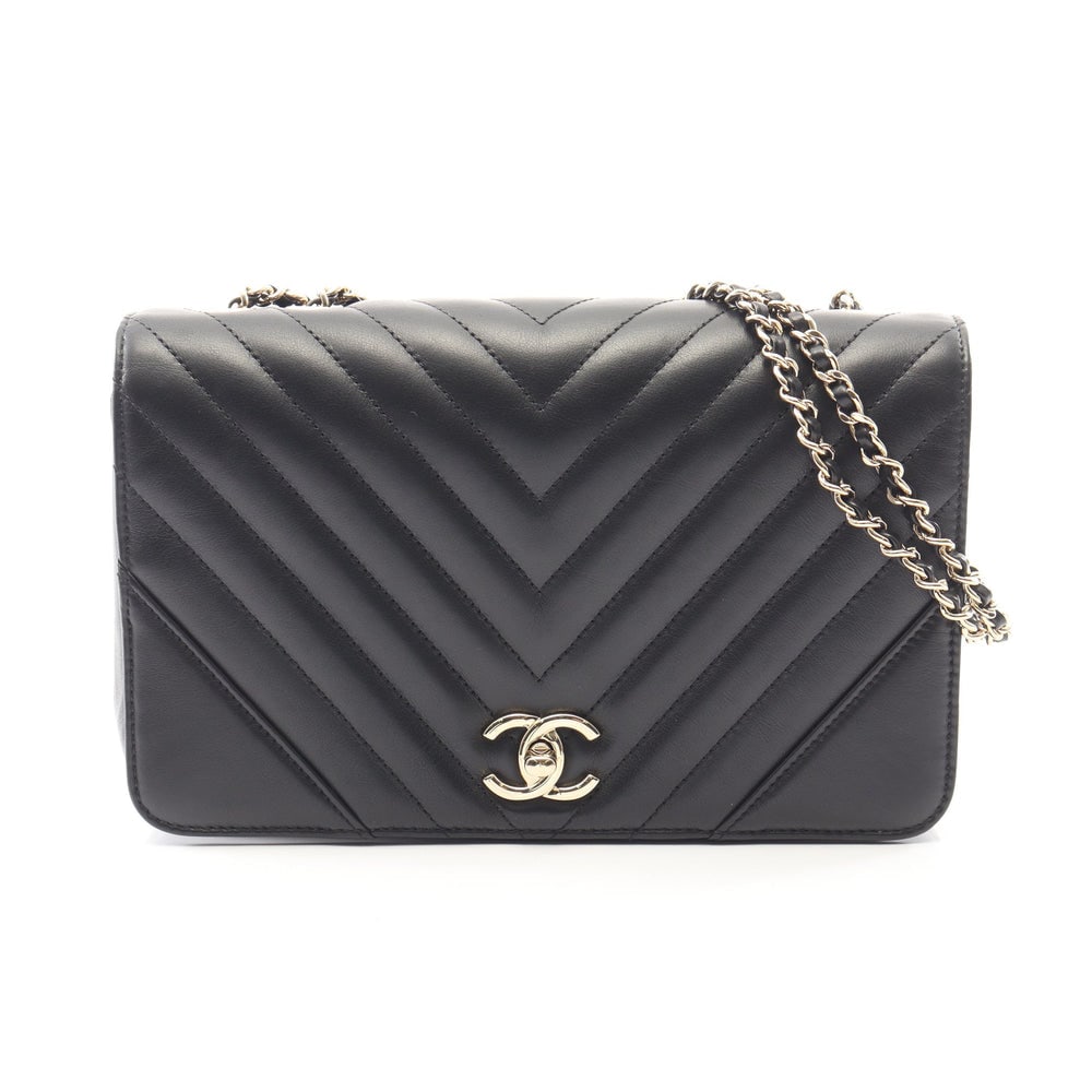 Chanel Chevron Flap Bag Black: Black lambskin chevron full flap chain shoulder bag with gold-tone hardware.