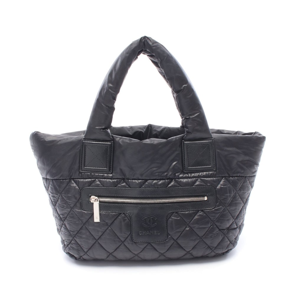 Chanel Coco Cocoon Small Black: Coco Cocoon Small reversible tote in black and bordeaux nylon leather with silver-tone hardware. Size 28 x 23 x 15 cm.
