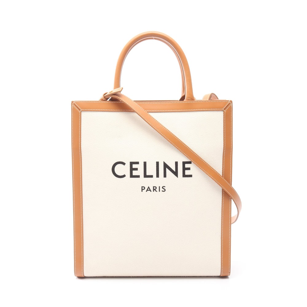 Celine Small Vertical Cabas Ivory: Small Vertical Cabas Triomphe 2 way tote in ivory and light brown canvas and leather. Size 28 x 32.5 x 8 cm.