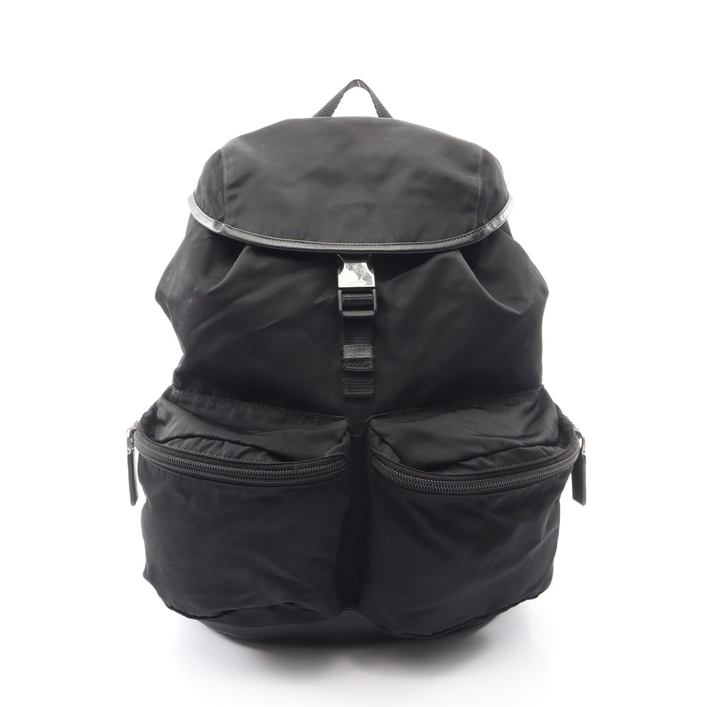 Prada Tessuto Backpack Black: Tessuto backpack in black nylon and saffiano leather. Size 29 x 35 x 16.5 cm. Handle 21 cm.