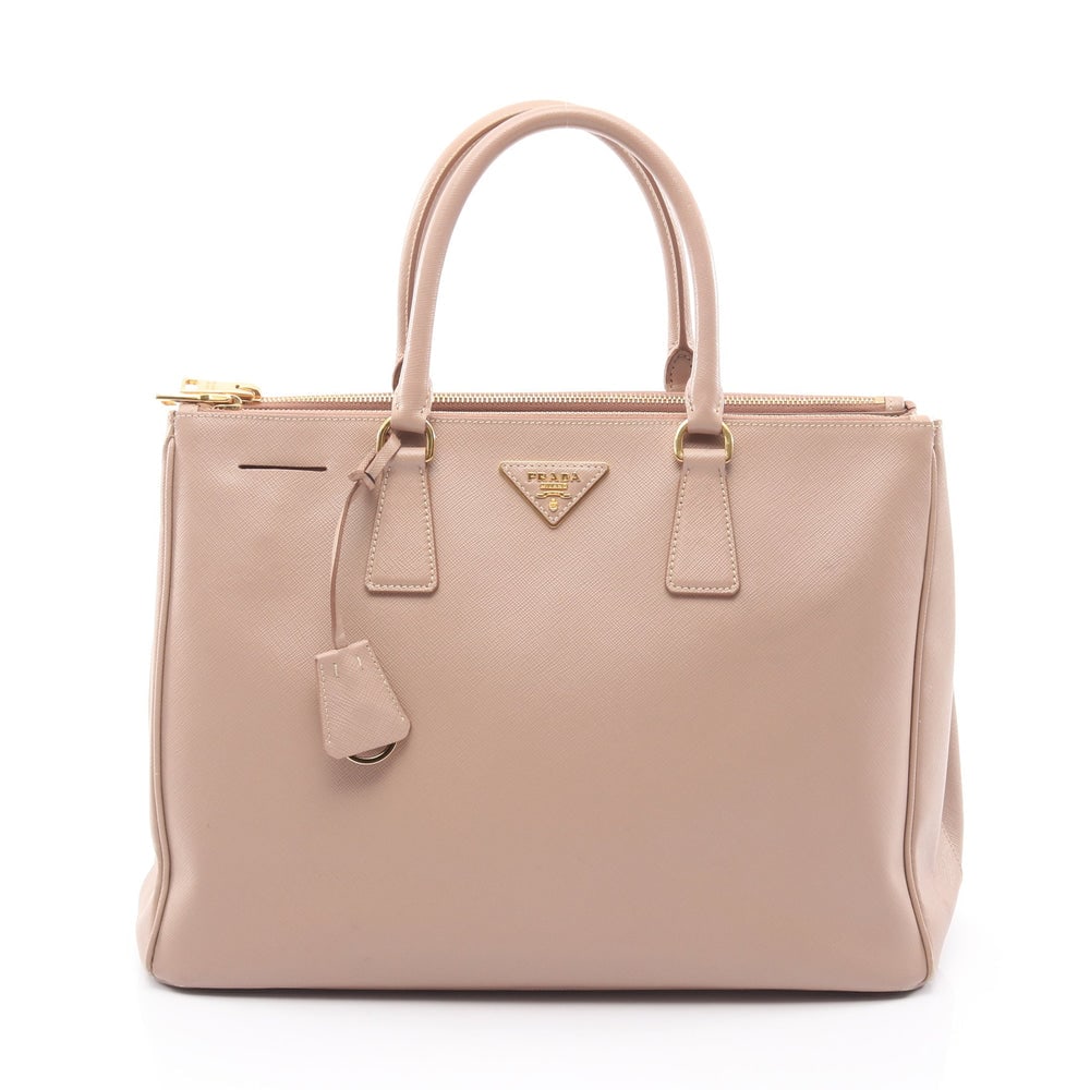 Prada Galleria Pink Beige: Galleria handbag in pink beige saffiano leather. Size 36 x 26 x 15.5 cm. Handle 36 cm.