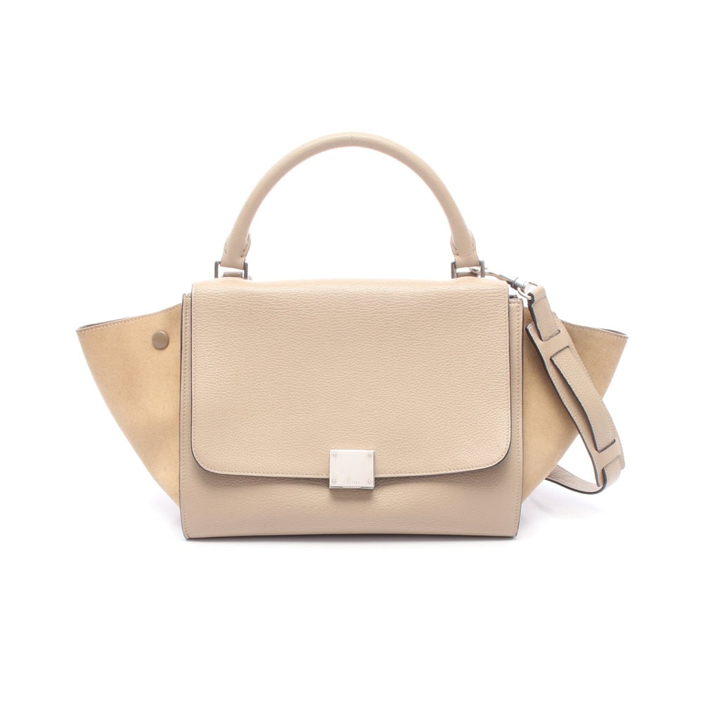 Celine Trapeze Small 2 Way Beige: Trapeze Small 2 way handbag in beige and light brown leather suede. Includes shoulder strap. Size 27 x 22 x 14 cm.