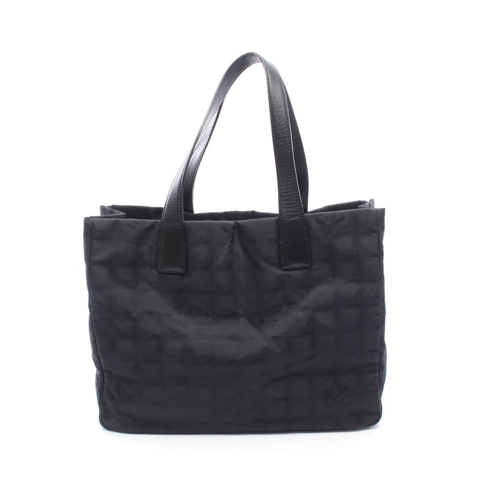 Chanel New Travel Line MM Black: New Travel Line MM tote in black nylon canvas and leather with gold-tone hardware. Size 34 x 25 x 14.5 cm.