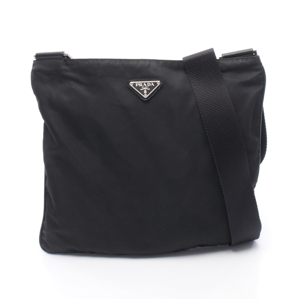 Prada Nylon Leather Shoulder Black: Shoulder bag VA0053 in black nylon and leather. Size 29 x 26 x 1 cm. Strap 71 to 130 cm.