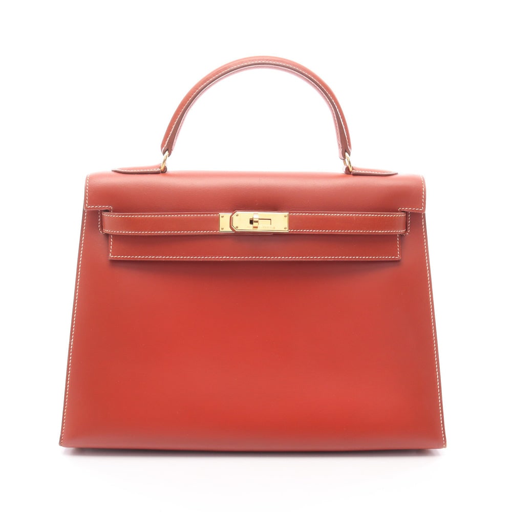Hermes Kelly 32 Brick: Orange brown box calf outside sewing 2-way handbag with gold-tone hardware.