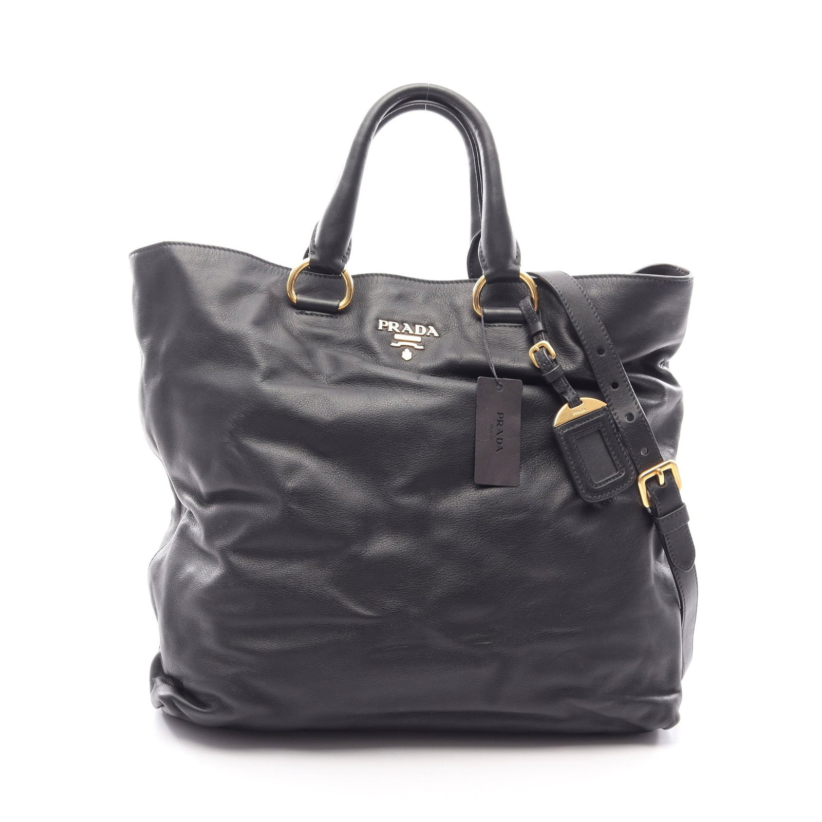 Prada Soft Calf 2 Way Black: Soft Calf 2 way tote in black leather. Includes shoulder strap, name tag, and guarantee card. Size 40 x 34.5 x 13 cm.