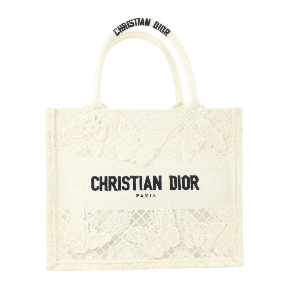 Dior Book Tote White: Book Tote handbag in white embroidered canvas. Size 26.5 x 21.5 x 14 cm.