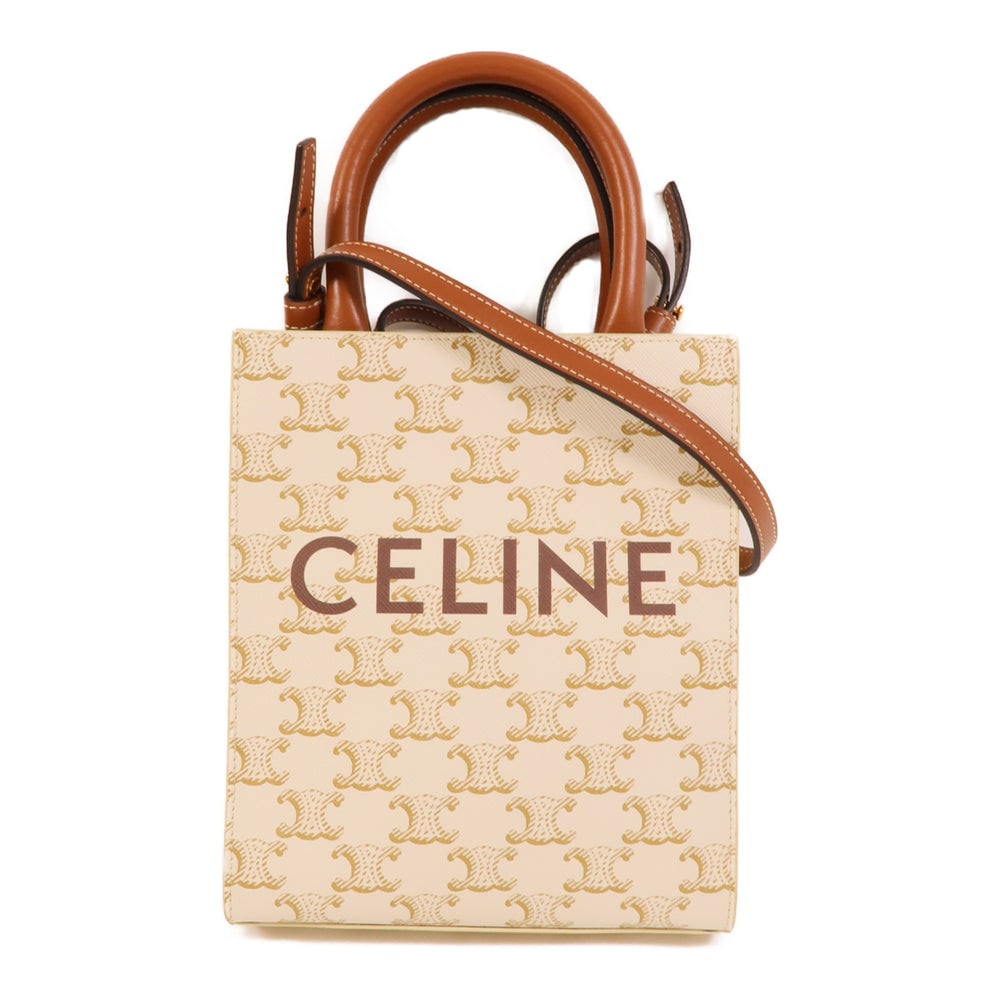 Celine Mini Vertical Cabas White: Mini Vertical Cabas 2 way shoulder bag in white coated canvas. Size 17 x 20.5 x 5 cm.
