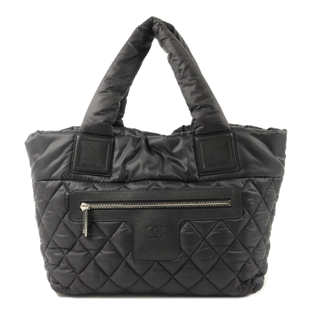 Chanel Coco Cocoon Small Black: Coco Cocoon Small handbag in black nylon with silver hardware. Includes hologram sticker and guarantee. Size 29 x 23 x 16 cm.