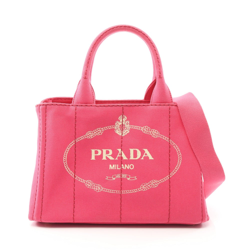 Prada Canapa 2 Way Pink Purple: Canapa 2 way tote 1BG439 in pink purple canvas. Includes shoulder strap and guarantee card. Size 28 x 19 x 14 cm.