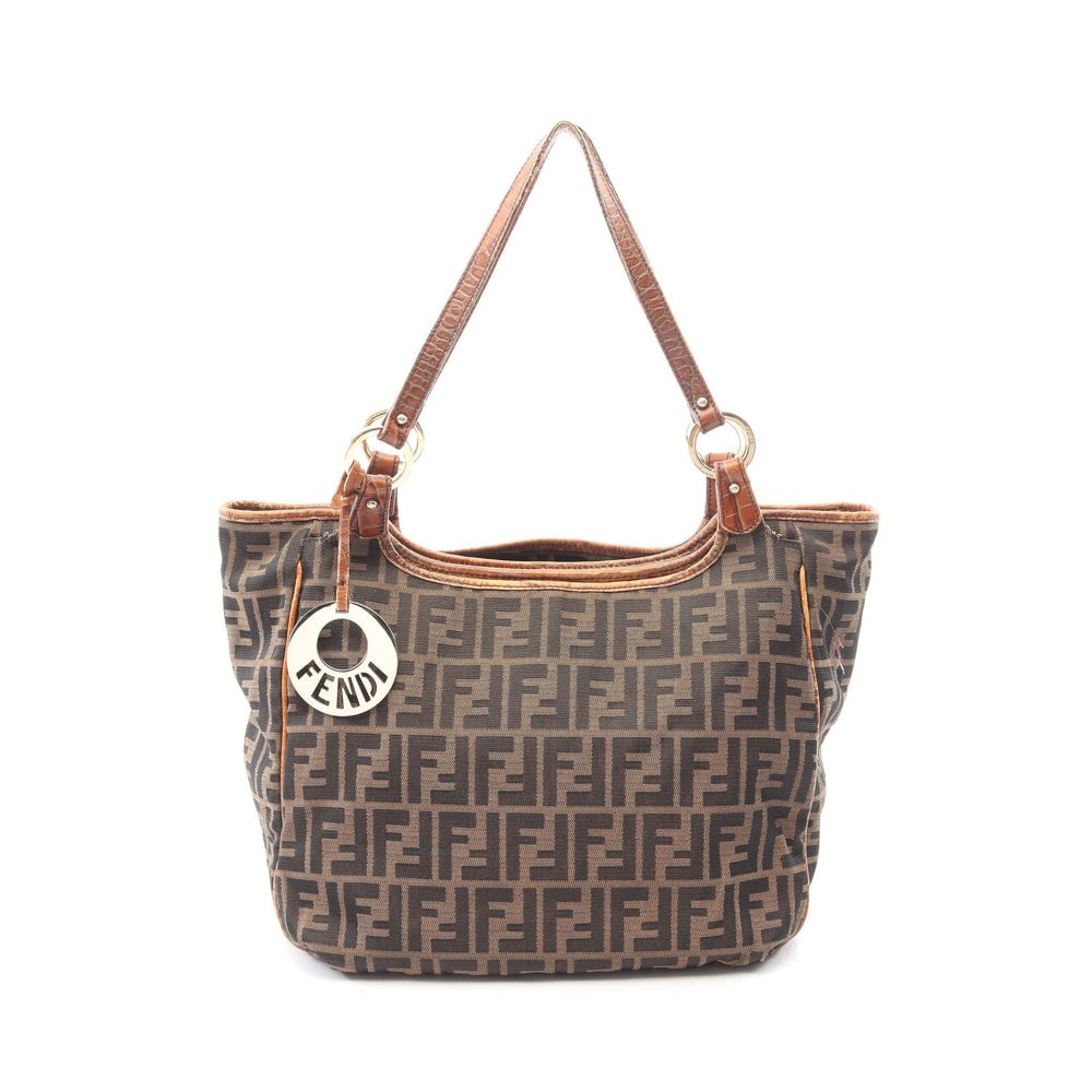 Fendi Zucca Shoulder Tote Brown: Zucca shoulder tote in brown nylon canvas and leather. Size 32 x 26 x 12 cm. Strap 52 cm.