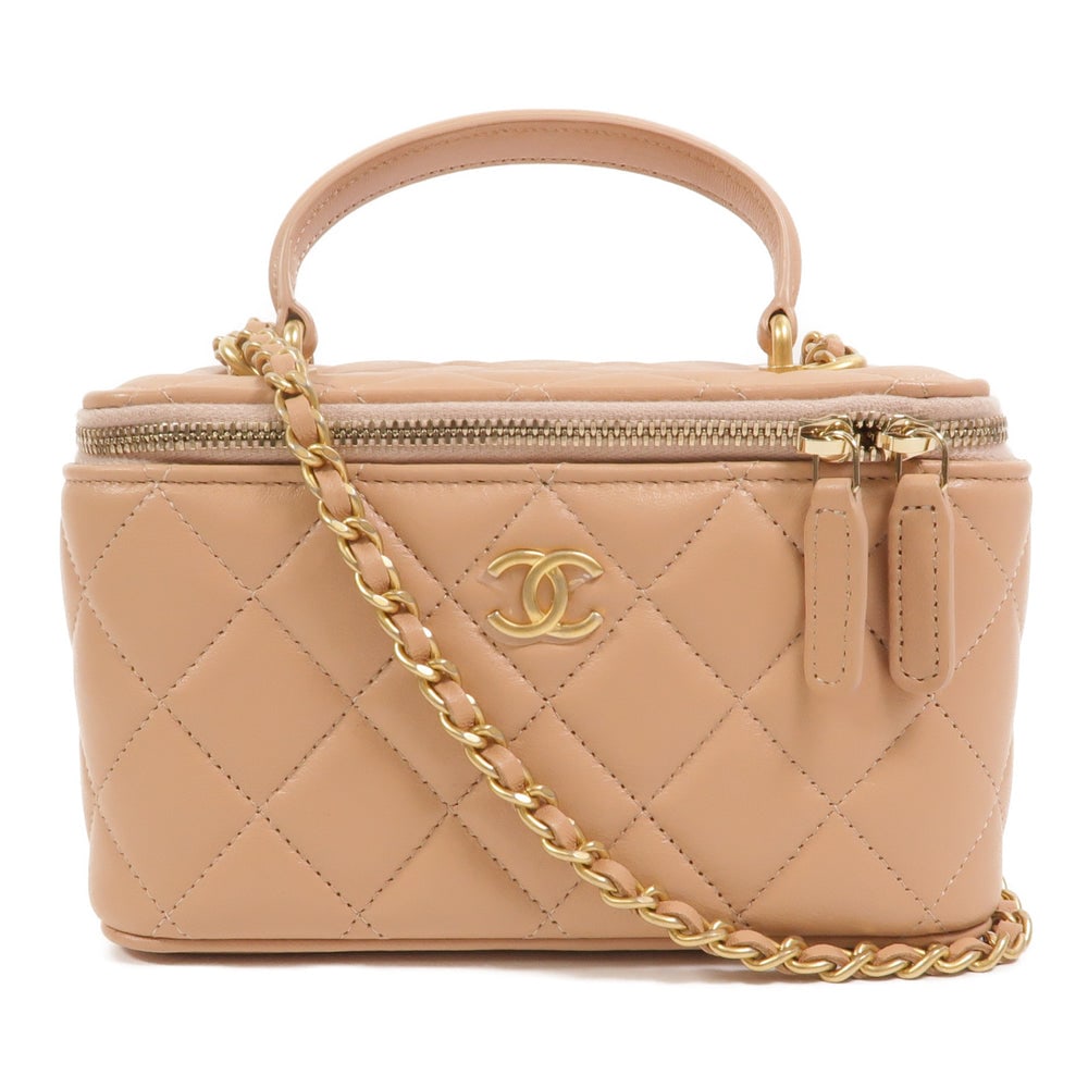 Chanel Top Handle Vanity Beige: Beige lambskin top handle vanity case with chain strap and gold-tone hardware.