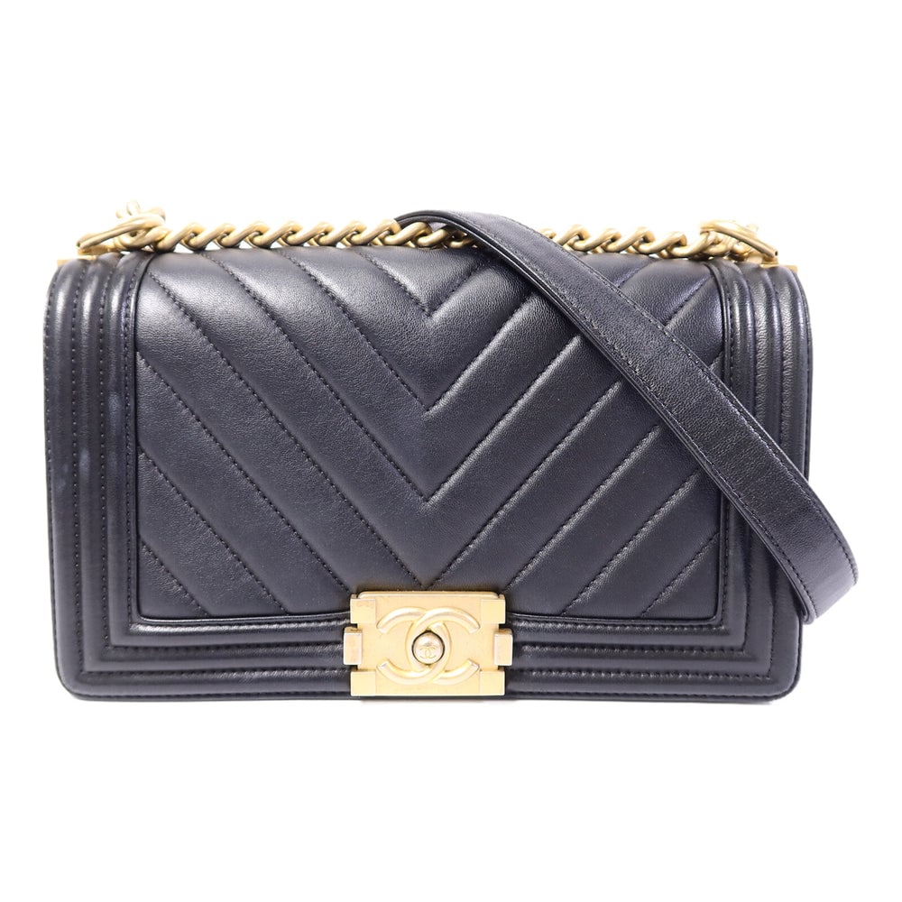 Chanel Boy 25 Lambskin Black: Black lambskin Boy 25 chain shoulder bag with gold-tone hardware.