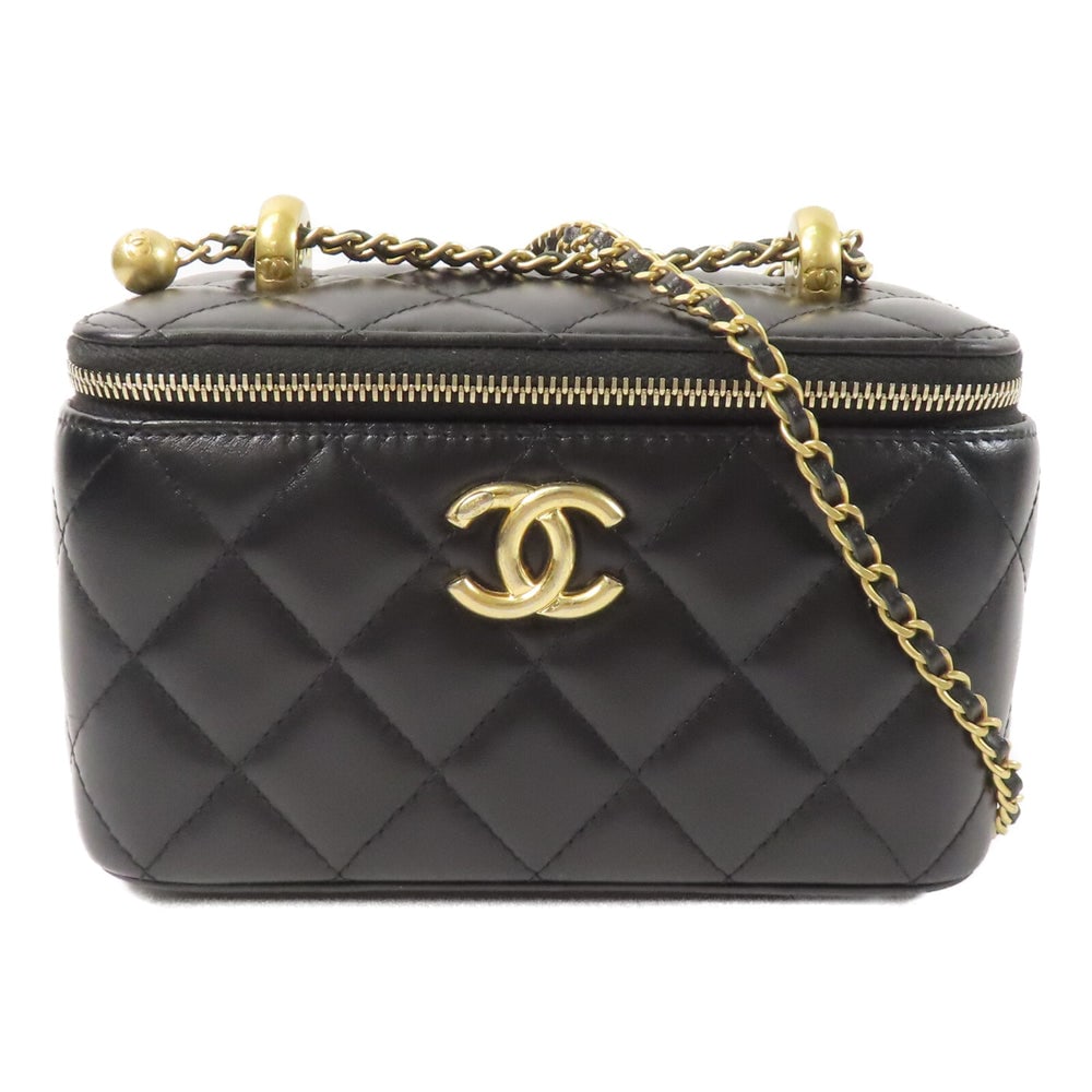 Chanel Vanity Case Black: Black lambskin vanity case with chain strap and gold-tone hardware.