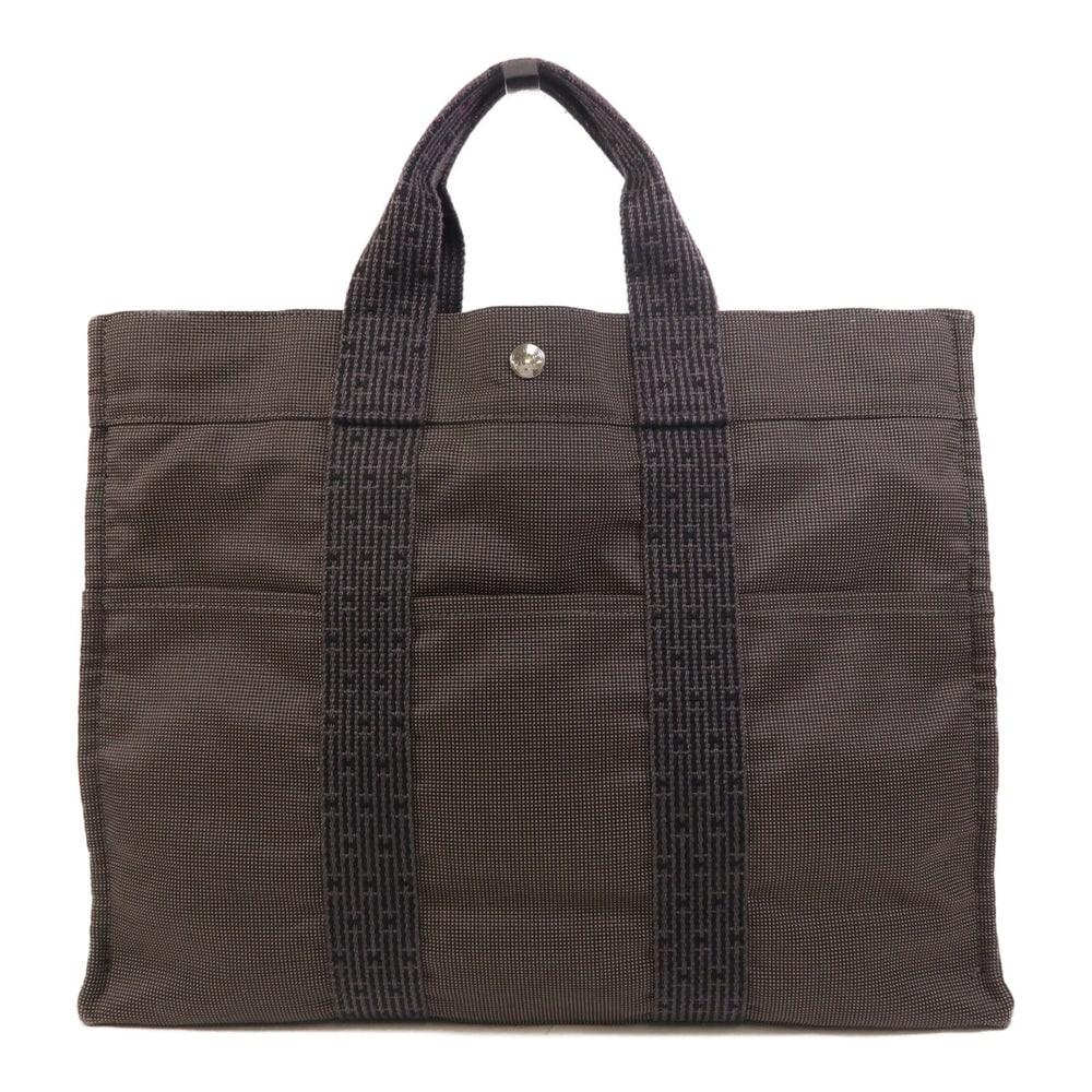 Hermes Herline MM Tote Gray: Herline MM hand and tote bag in gray canvas with palladium-tone hardware. Size 43 x 32 x 10.5 cm. Handle 28 cm.