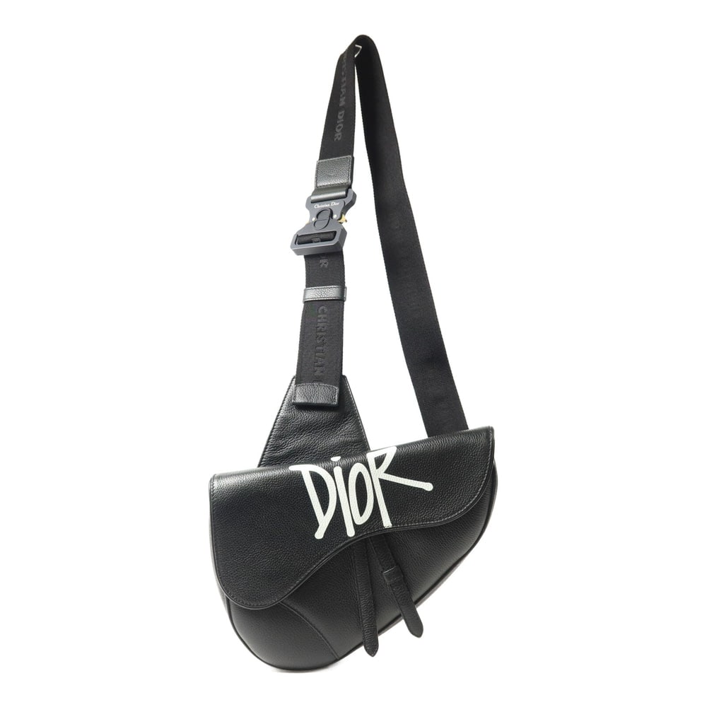 Dior x Stussy Saddle Bag: Black calfskin shoulder bag.