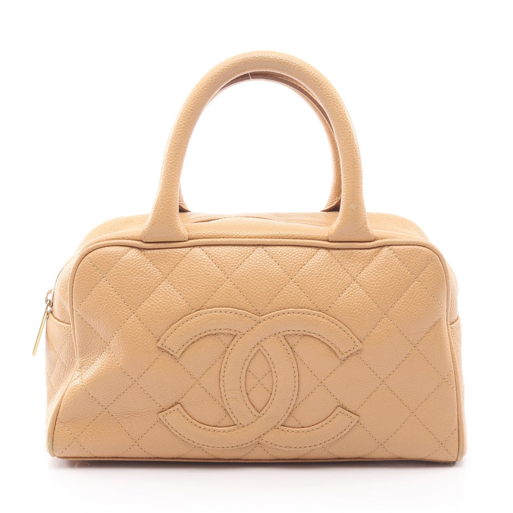 Chanel Matelasse Mini Boston: Beige caviar skin mini boston handbag.
