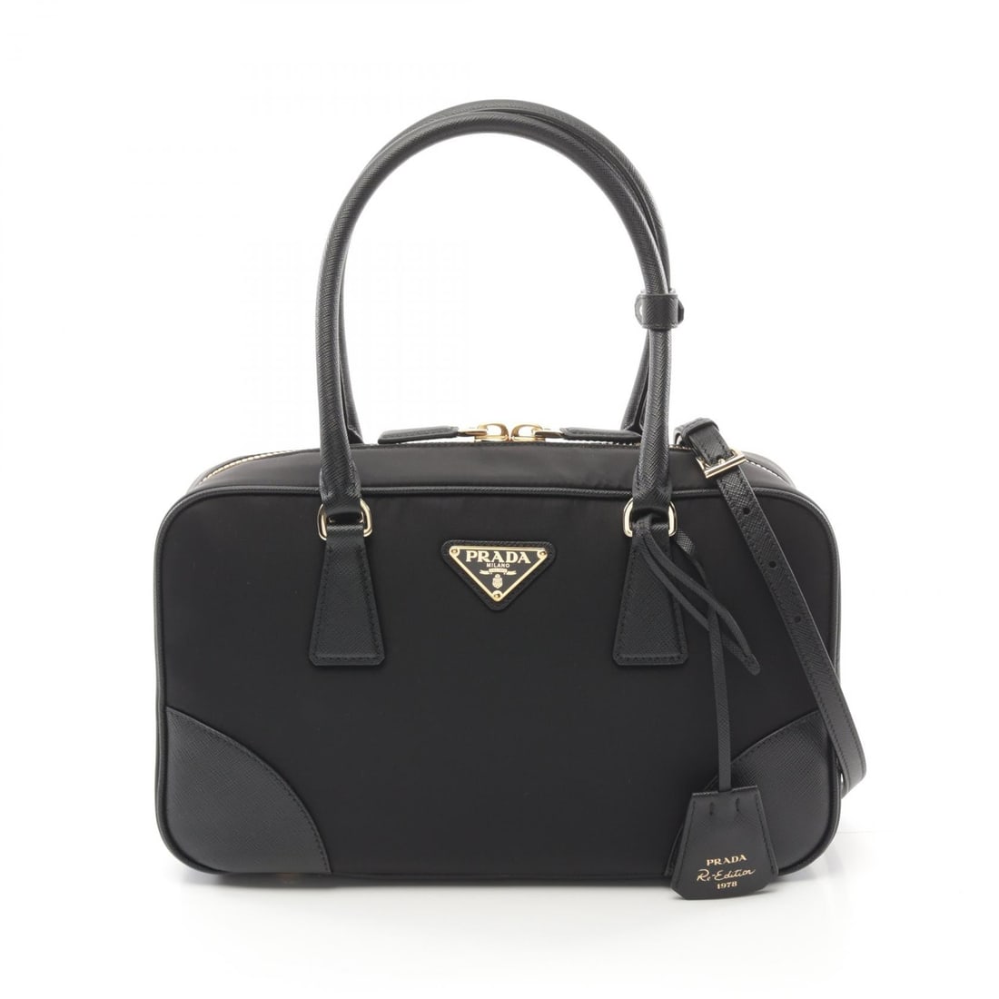 Prada Re-Edition 1978 Black: Re-Edition 1978 Medium Double Handle 2 way handbag 1BB115R064F0002 in black Re-Nylon and saffiano leather; includes storage bags, shoulder strap, crochet with key ring, and poignet; 29 x 18 x 9 cm.